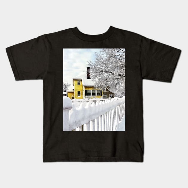 Yellow House with Snow Covered Picket Fence Kids T-Shirt by SusanSavad